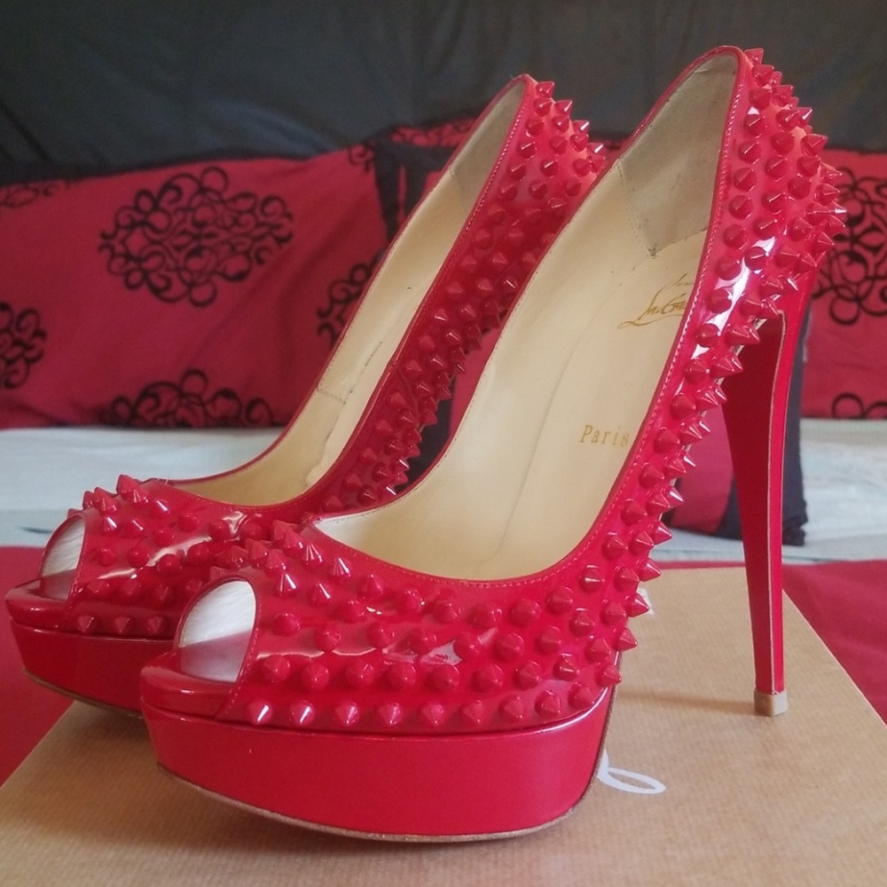 Christian Louboutin red spike pumps